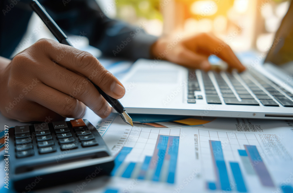 Person Using a Calculator for Financial Calculations, Essential for Business Planning and Accounting. Represents Accurate and Strategic Economic Management. Person Using a Calculator for Financial Calculations, Essential for Business Planning and Accounting. Represents Accurate and Strategic Economic Management.