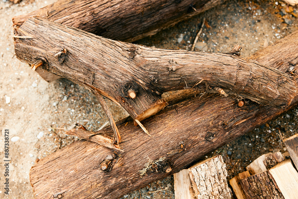 stacks of logs and firewood piled up in a rustic outdoor setting stacks of logs and firewood piled up in a rustic outdoor setting