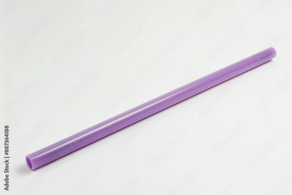 A long straw on a white background, straight and slender, suitable for drinking tea or juice. A long straw on a white background, straight and slender, suitable for drinking tea or juice.