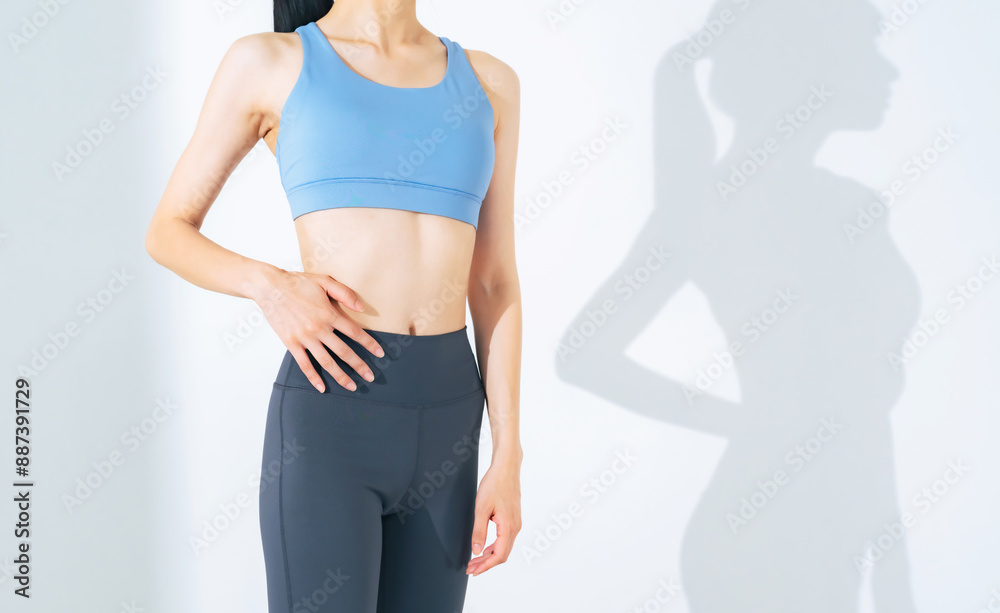 The concept of a woman getting in shape through training. Body care. Dieting. Fitness. The concept of a woman getting in shape through training. Body care. Dieting. Fitness.