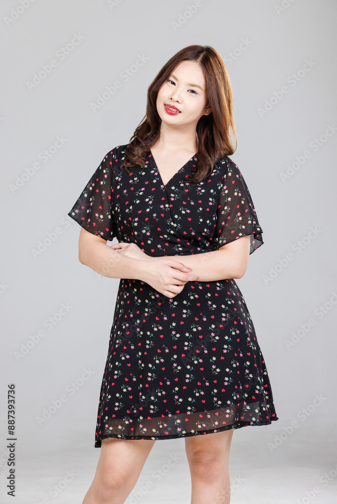 Portrait of Asian cute cheerful young girl wearing small flower pattern color black dress, stylish model woman happy and cool sweet smile posing isolated on white background, Teenage and youth fashion