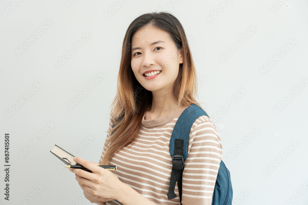 Portrait beautiful Asian woman student. Smile girl happy study. read book in college campus. young female on international Asia University. Education, study, school, learning, exam, continue education Portrait beautiful Asian woman student. Smile girl happy study. read book in college campus. young female on international Asia University. Education, study, school, learning, exam, continue education