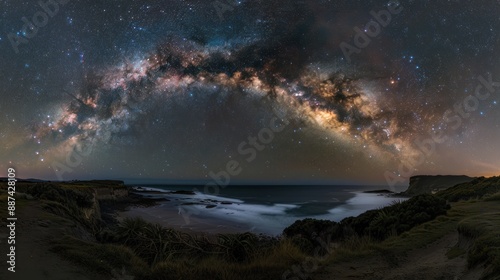 Milky Way arching over a serene coastal landscape