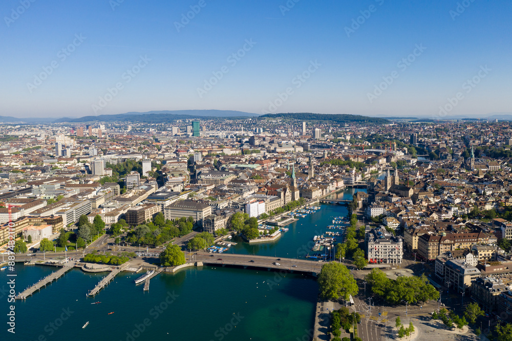 Zurich, Switzerland: Aerial drone view of the famous Zurich old town along the Limmat river and lake Zurich on a sunny summer day in Switzerland largest city. Zurich, Switzerland: Aerial drone view of the famous Zurich old town along the Limmat river and lake Zurich on a sunny summer day in Switzerland largest city.