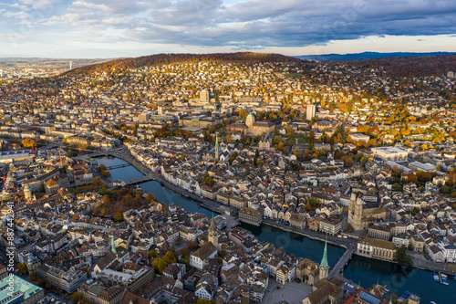 Zurich, Switzerland: Aerial drone view of Zurich city center with the old town and the business district along the Limmat river in autumn in Switzerland largest city.