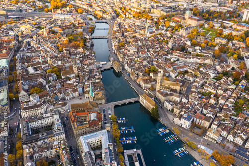 Obraz na płótnie Zurich, Switzerland: Aerial drone view of Zurich city center with the old town and the business district along the Limmat river in autumn in Switzerland largest city. w salonie