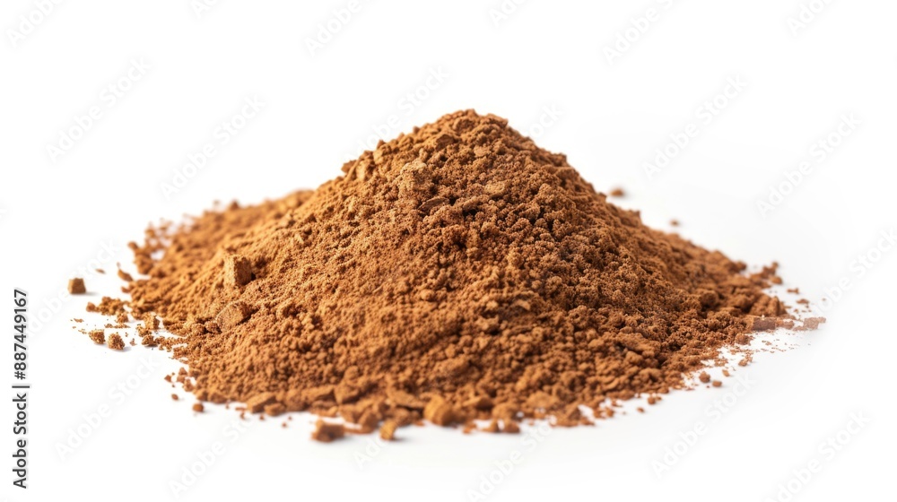 A large amount of cocoa powder spills out on a white surface A large amount of cocoa powder spills out on a white surface