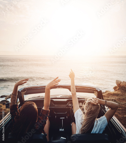 Friends, woman and sunset in car at beach with freedom, scenery and travel adventure with mockup space. Road trip, people and convertible vehicle on coast at ocean for sightseeing and sunrise view