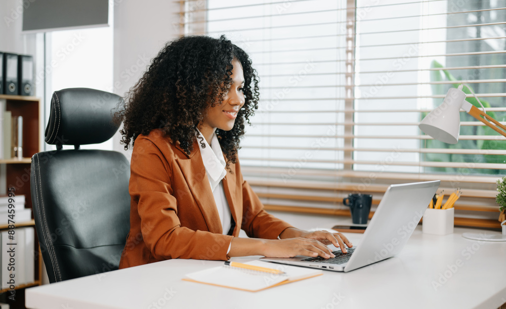 Businesswoman Analyzing Finance on Tablet and Laptop at modern Office Desk tax Businesswoman Analyzing Finance on Tablet and Laptop at modern Office Desk tax