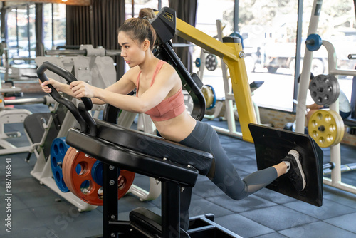 Canvas Print Young woman using butt blaster machine, or booty blaster machine, during her mor