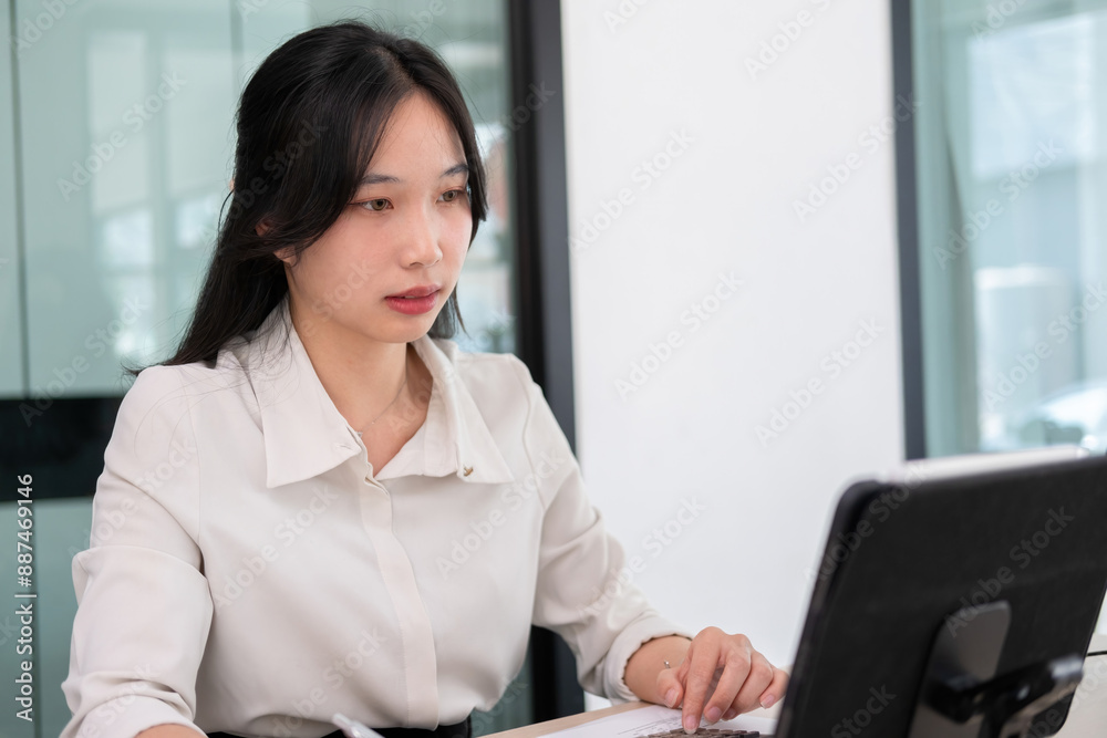 Young woman examines stock graphs at tablet Young woman examines stock graphs at tablet