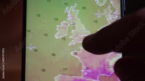 Finger searching weather on mobile device. 
Heat over Europe weather hot mobile device.
Shot of a computer mobile phone device screen. Heat wave around the world. Europe America USA Asia Africa