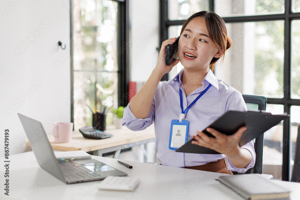 Happy asian business woman call centre representative customer support agent talking to client, smiling asian female working using laptop computer in office. Happy asian business woman call centre representative customer support agent talking to client, smiling asian female working using laptop computer in office.