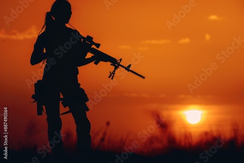 A silhouette of a woman holding a rifle against the setting sun, with a desert or rural landscape in the background © Fotograf
