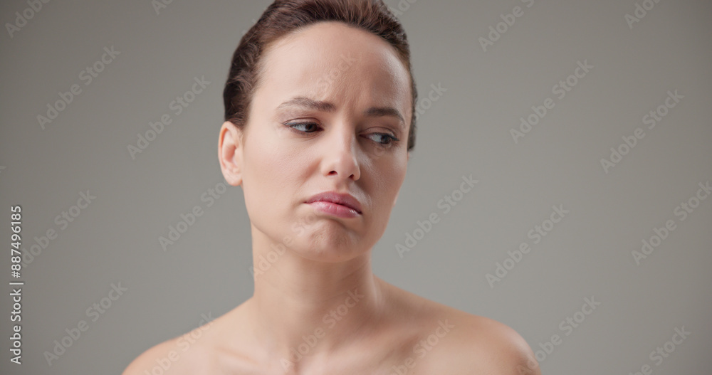 Beauty, health, cosmetics, anti-aging therapy and skin care concept - young beautiful brunette Caucasian woman in a bad mood, upset and disappointed experiencing negative emotions Beauty, health, cosmetics, anti-aging therapy and skin care concept - young beautiful brunette Caucasian woman in a bad mood, upset and disappointed experiencing negative emotions