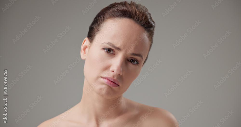 Fototapeta premium Beauty, health, cosmetics, anti-aging therapy and skin care concept - young beautiful brunette Caucasian woman in a bad mood, upset and disappointed experiencing negative emotions