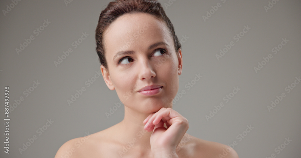 Concept of beauty, health, cosmetics, anti-aging therapy and skin care - young beautiful brunette Caucasian woman thoughtfully looks around making difficult choice thinking through actions Concept of beauty, health, cosmetics, anti-aging therapy and skin care - young beautiful brunette Caucasian woman thoughtfully looks around making difficult choice thinking through actions