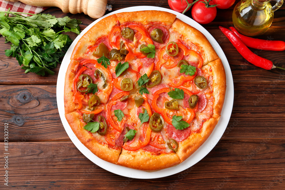 Delicious pizza Diablo and ingredients on wooden table, flat lay Delicious pizza Diablo and ingredients on wooden table, flat lay