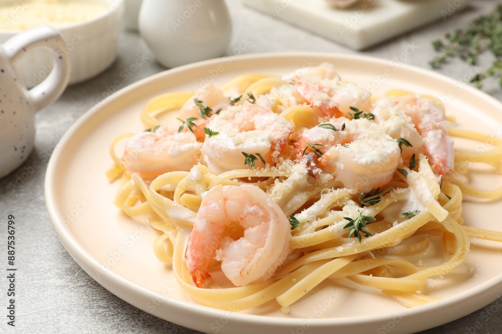 Delicious pasta with shrimps served on grey table, closeup Delicious pasta with shrimps served on grey table, closeup