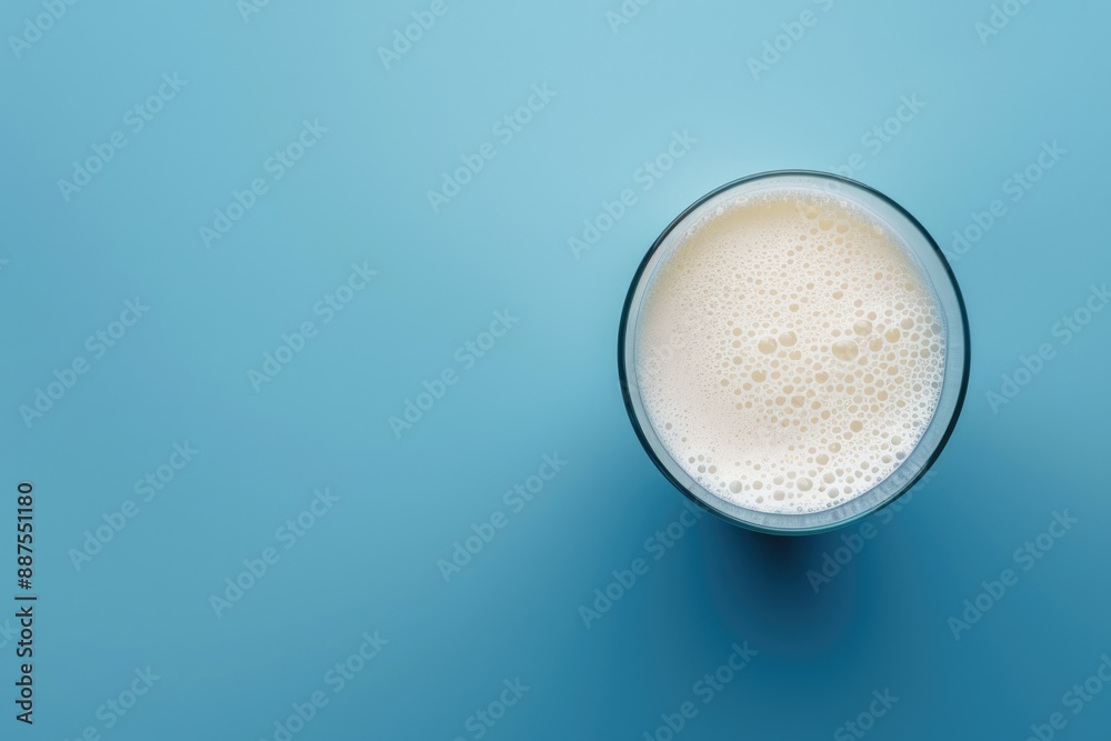 World Milk Day celebration with glass of milk on blue background. World Milk Day celebration with glass of milk on blue background.