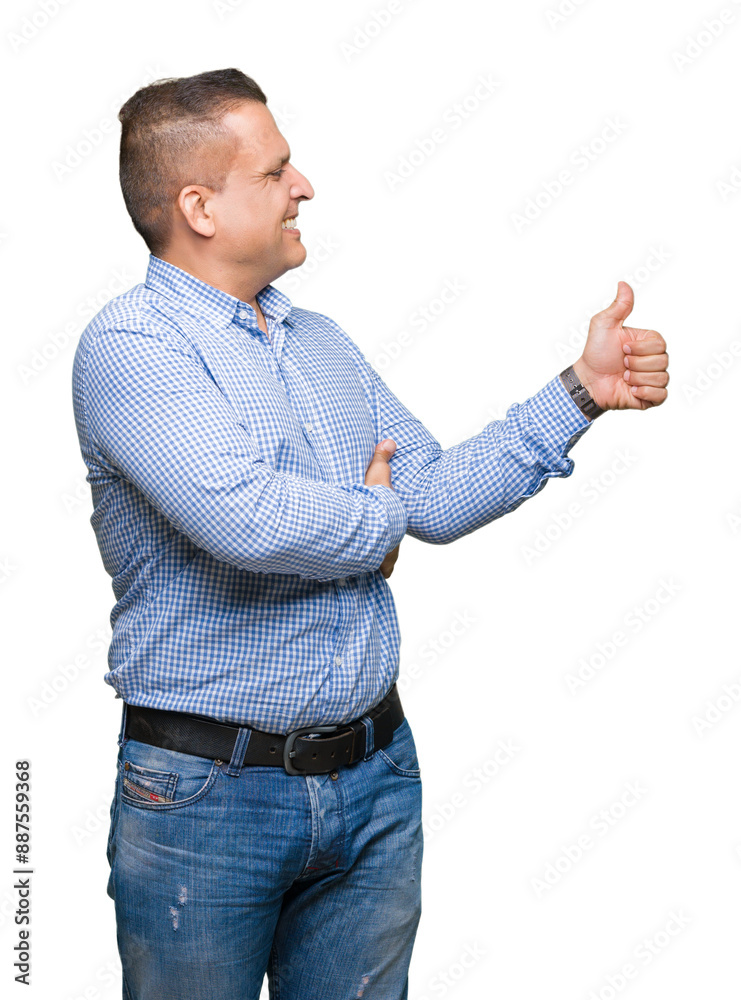 Middle age arab business man over isolated background Looking proud, smiling doing thumbs up gesture to the side Middle age arab business man over isolated background Looking proud, smiling doing thumbs up gesture to the side