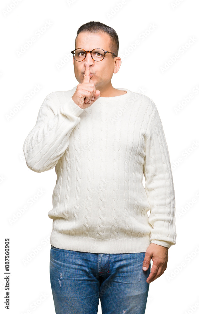 Middle age arab man wearing glasses over isolated background asking to be quiet with finger on lips. Silence and secret concept. Middle age arab man wearing glasses over isolated background asking to be quiet with finger on lips. Silence and secret concept.