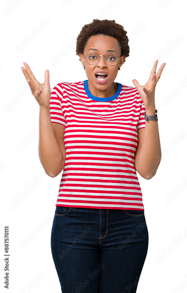 Beautiful young african american woman wearing glasses over isolated background celebrating crazy and amazed for success with arms raised and open eyes screaming excited. Winner concept Beautiful young african american woman wearing glasses over isolated background celebrating crazy and amazed for success with arms raised and open eyes screaming excited. Winner concept