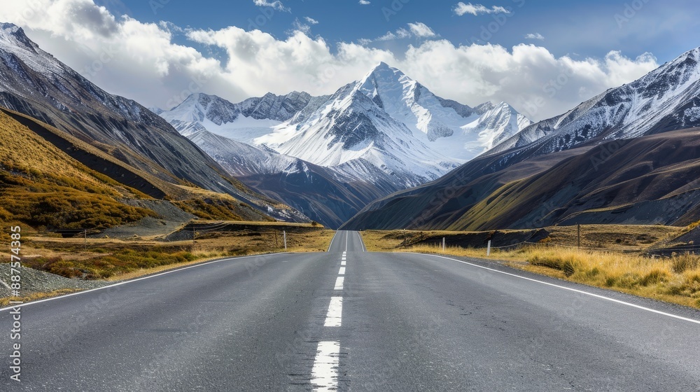 Mountain Road Journey - A long, straight road cutting through a mountain pass, the snow-capped peaks towering above and a blue sky with fluffy clouds. Mountain Road Journey - A long, straight road cutting through a mountain pass, the snow-capped peaks towering above and a blue sky with fluffy clouds.