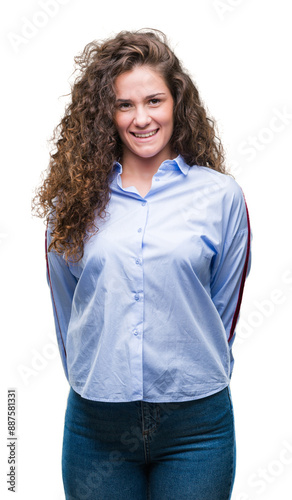 Beautiful brunette curly hair young girl wearing elgant look over isolated background with a happy and cool smile on face. Lucky person. photo