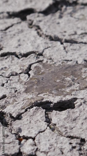 Wallpaper Mural Single water drop falls onto lifeless desert landscape with cracked ground. Dry lake bed. Drought and crisis environment caused by lack of moisture. Cracked mud, reduction in water content Torontodigital.ca