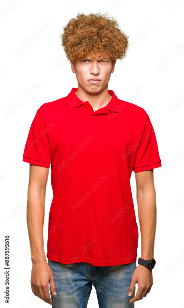 Young handsome man with afro hair wearing red t-shirt skeptic and nervous, frowning upset because of problem. Negative person. Young handsome man with afro hair wearing red t-shirt skeptic and nervous, frowning upset because of problem. Negative person.