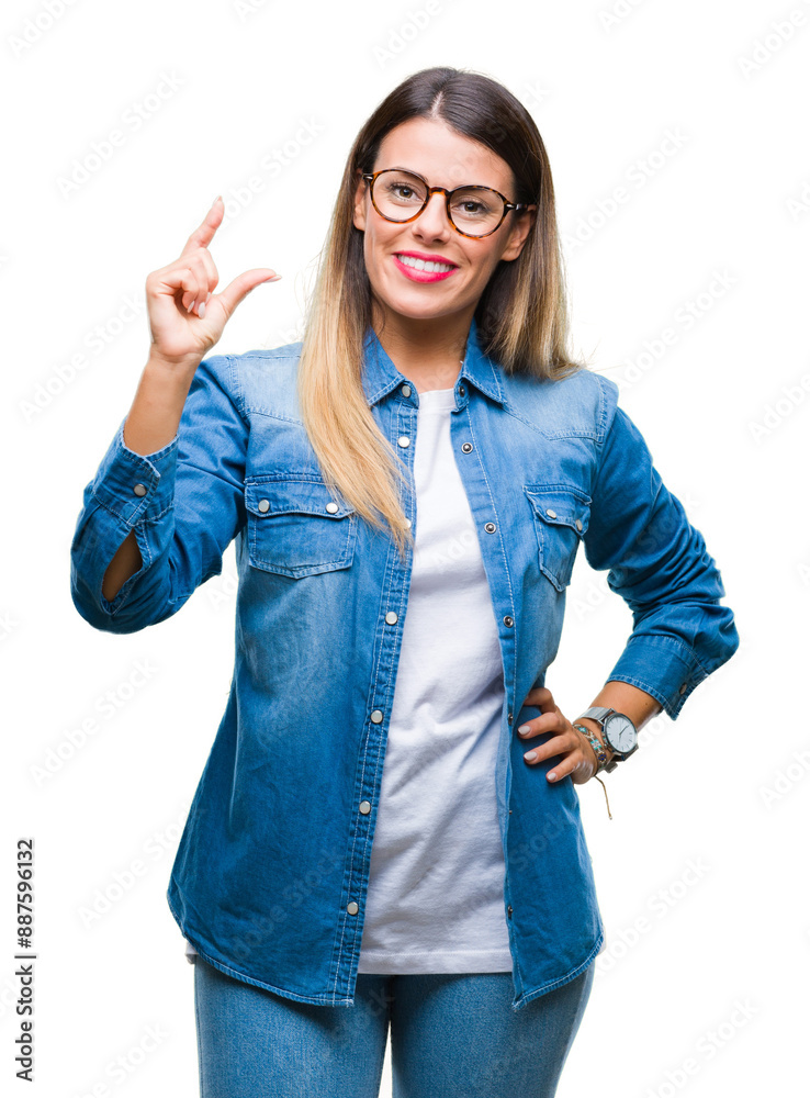 Young beautiful woman over wearing glasses over isolated background smiling and confident gesturing with hand doing size sign with fingers while looking and the camera. Measure concept. Young beautiful woman over wearing glasses over isolated background smiling and confident gesturing with hand doing size sign with fingers while looking and the camera. Measure concept.