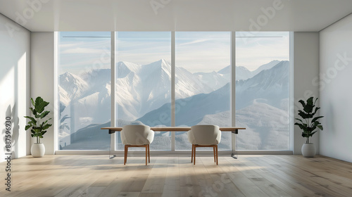 A minimalist office space featuring two chairs and a desk facing large panoramic windows with a breathtaking view of snow-capped mountains. The room is bright with natural light