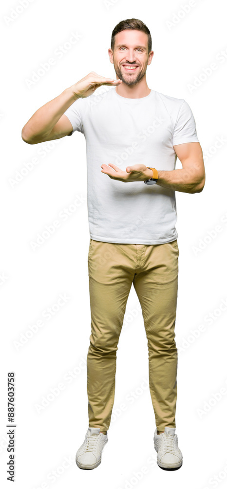 Handsome man wearing casual white t-shirt gesturing with hands showing big and large size sign, measure symbol. Smiling looking at the camera. Measuring concept. Handsome man wearing casual white t-shirt gesturing with hands showing big and large size sign, measure symbol. Smiling looking at the camera. Measuring concept.