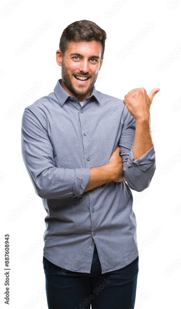 Young handsome man over isolated background smiling with happy face looking and pointing to the side with thumb up. Young handsome man over isolated background smiling with happy face looking and pointing to the side with thumb up.