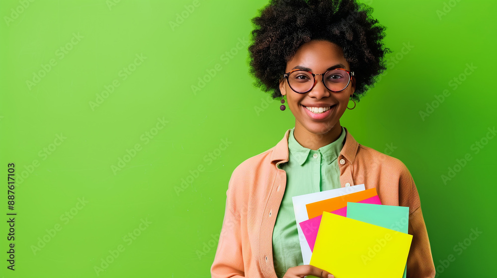 Joyful entrepreneur with a vision board, smiling confidently. Bright green background, casual professional attire, modern business concept. Joyful entrepreneur with a vision board, smiling confidently. Bright green background, casual professional attire, modern business concept.