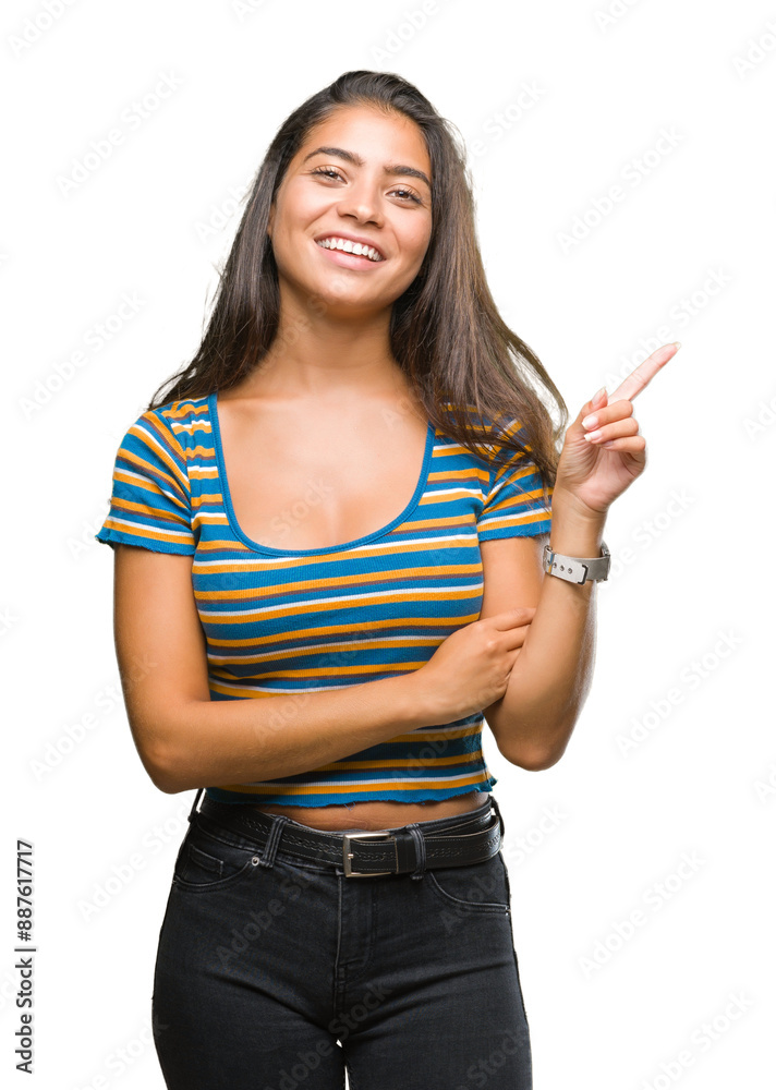 Young beautiful arab woman over isolated background with a big smile on face, pointing with hand and finger to the side looking at the camera. Young beautiful arab woman over isolated background with a big smile on face, pointing with hand and finger to the side looking at the camera.