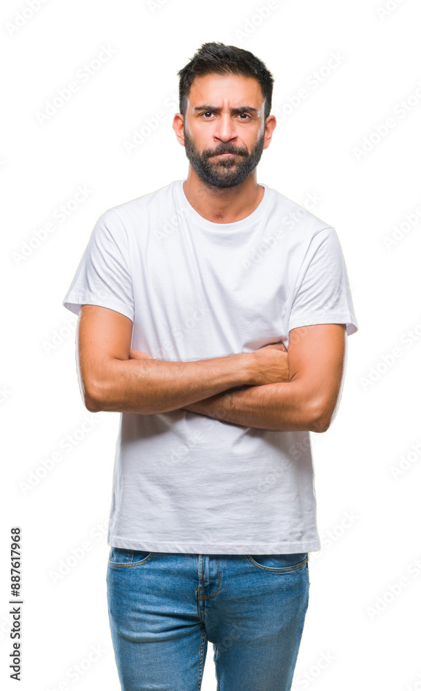 Obraz premium Adult hispanic man over isolated background skeptic and nervous, disapproving expression on face with crossed arms. Negative person.