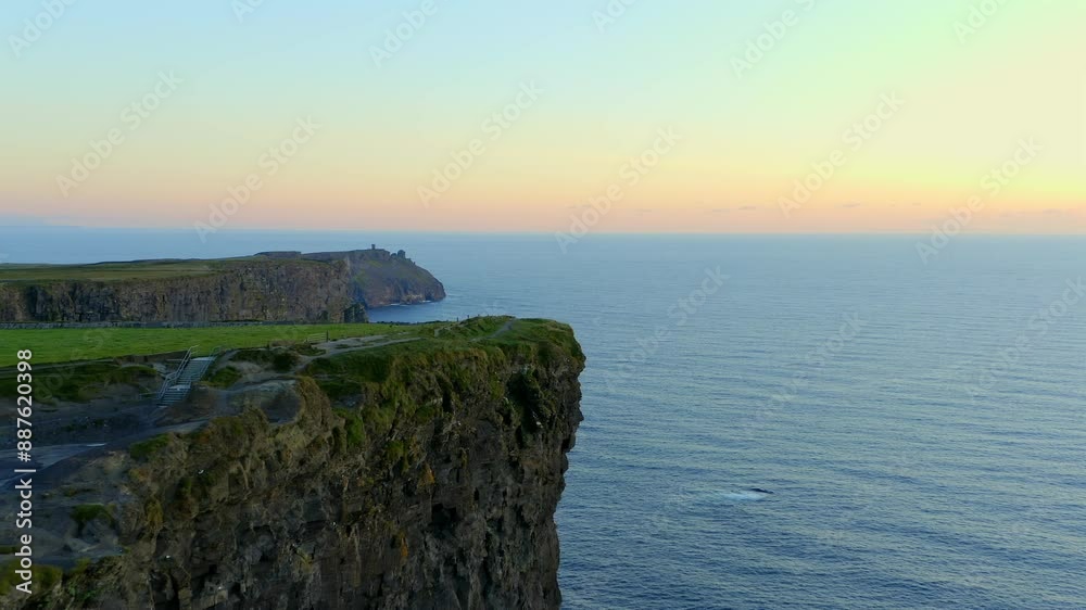 Aerial dolly captures stunning sunset over the southern cliffs of Moher Aerial dolly captures stunning sunset over the southern cliffs of Moher