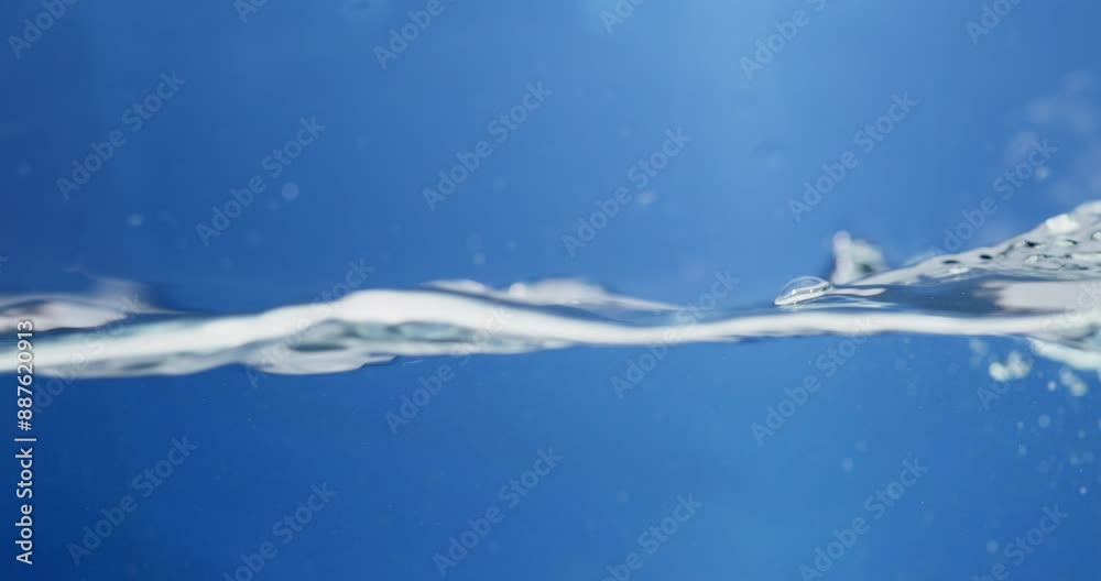 Refreshing Aqua Clean Water Droplets Cascading in Slow Motion. Blue Bliss Abstract Water Background with Gentle Ripple Motion. Refreshing Aqua Clean Water Droplets Cascading in Slow Motion. Blue Bliss Abstract Water Background with Gentle Ripple Motion.
