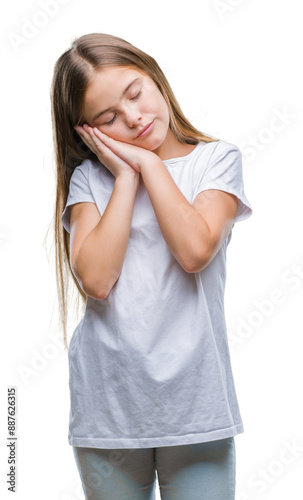 Young beautiful girl over isolated background sleeping tired dreaming and posing with hands together while smiling with closed eyes.