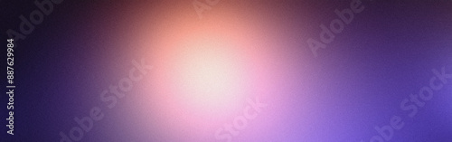 Soft grainy texture with a bright center and a pink to purple color transition in an abstract background