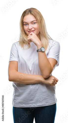 Young caucasian woman over isolated background looking confident at the camera with smile with crossed arms and hand raised on chin. Thinking positive.