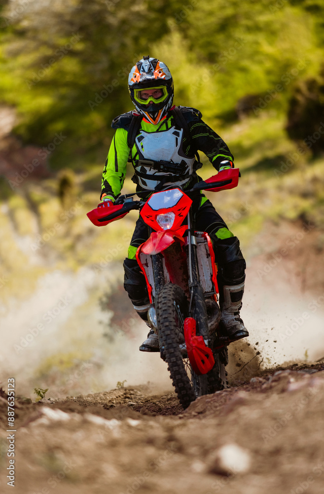 Professional enduro bike rider on action, dirt ride on the dusty track Motocross sport. Professional enduro bike rider on action, dirt ride on the dusty track Motocross sport.