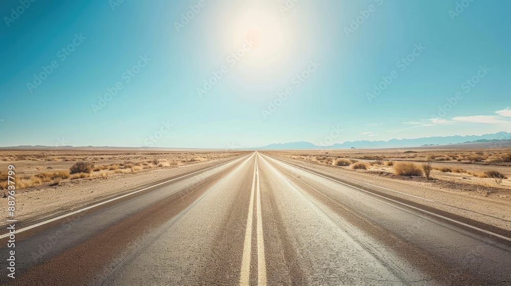 Naklejka premium Long and winding road through the middle of a vast desert landscape