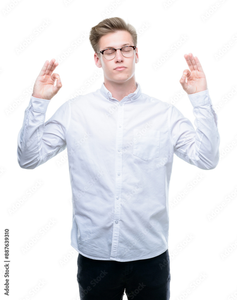 Young handsome blond man relax and smiling with eyes closed doing meditation gesture with fingers. Yoga concept. Young handsome blond man relax and smiling with eyes closed doing meditation gesture with fingers. Yoga concept.