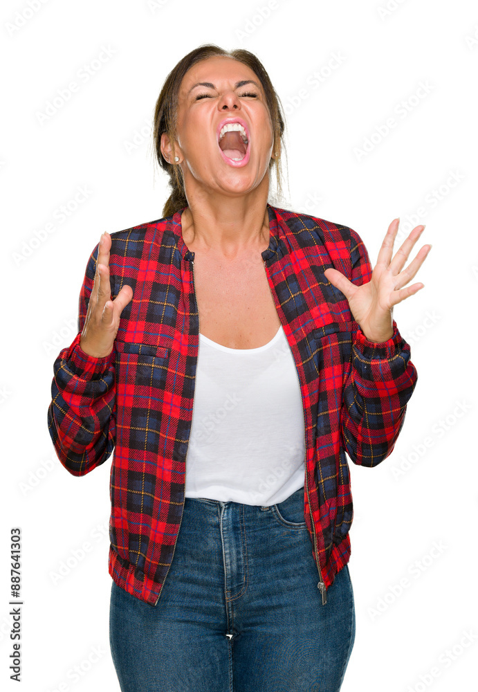 Middle age adult woman wearing casual jacket over isolated background crazy and mad shouting and yelling with aggressive expression and arms raised. Frustration concept. Middle age adult woman wearing casual jacket over isolated background crazy and mad shouting and yelling with aggressive expression and arms raised. Frustration concept.