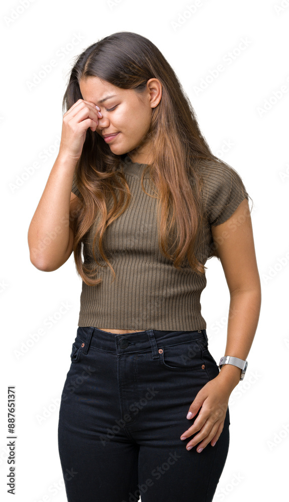 Young beautiful brunette woman over isolated background tired rubbing nose and eyes feeling fatigue and headache. Stress and frustration concept. Young beautiful brunette woman over isolated background tired rubbing nose and eyes feeling fatigue and headache. Stress and frustration concept.