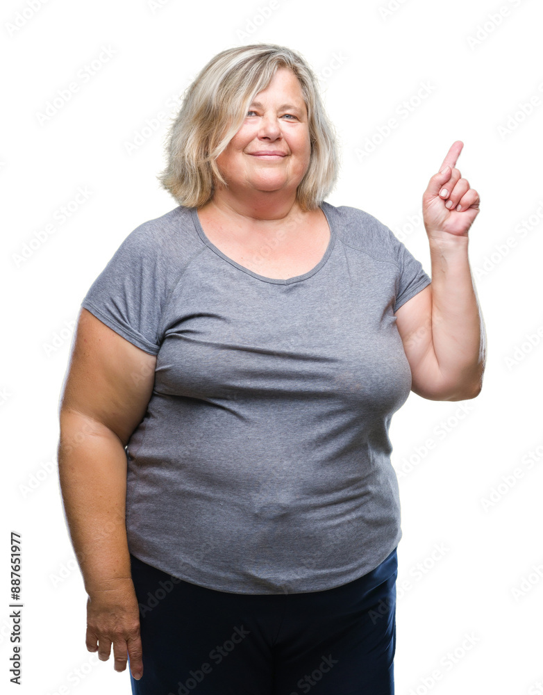 Senior plus size caucasian woman over isolated background with a big smile on face, pointing with hand and finger to the side looking at the camera. Senior plus size caucasian woman over isolated background with a big smile on face, pointing with hand and finger to the side looking at the camera.