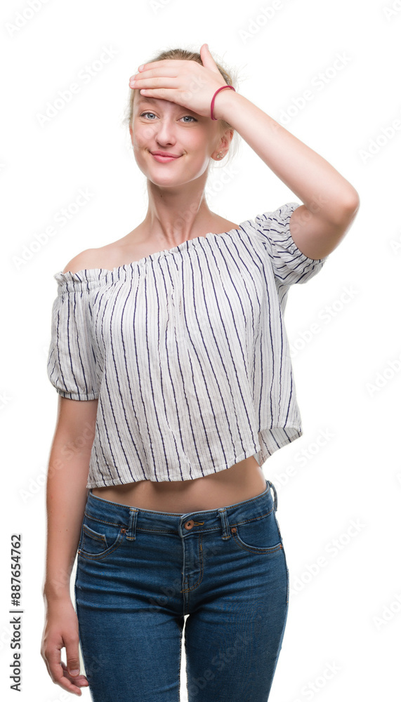 Blonde teenager woman wearing a bun stressed with hand on head, shocked with shame and surprise face, angry and frustrated. Fear and upset for mistake. Blonde teenager woman wearing a bun stressed with hand on head, shocked with shame and surprise face, angry and frustrated. Fear and upset for mistake.